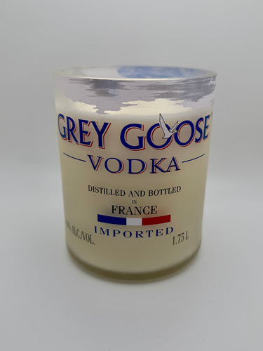 Glass container labeled 'Grey Goose Vodka' on a white background
